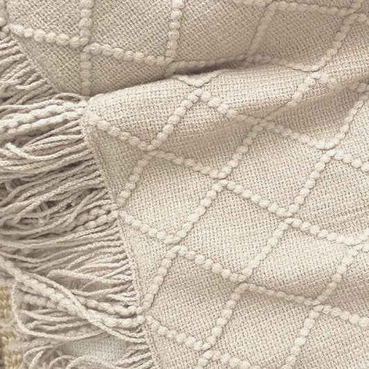 Close-up of the BOHEM knit and fringe in White Clay
